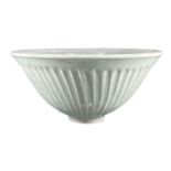 MANNER OF LUCIE RIE, STUDIO POTTERY BOWL Fluted outer rim, glazed, impressed underglaze