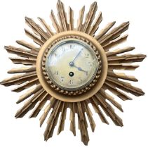 AN EARLY 20TH CENTURY FRENCH CARVED GILTWOOD SUNBURST WALL CLOCK. (38cm x 39cm)