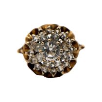 A VINTAGE 9CT GOLD AND QUARTZ CLUSTER DRESS RING The central surmounted round cut quartz (approx.