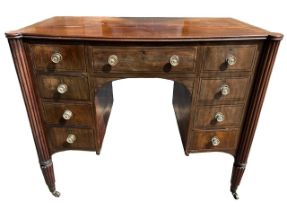 MANNER OF GILLOWS, A 19TH CENTURY REGENCY MAHOGANY AND EBONY LINE INLAID BOW FRONTED WRITING TABLE