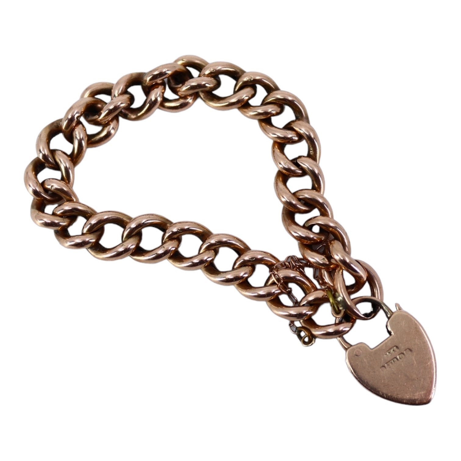 AN EDWARDIAN 9CT ROSE GOLD CURB LINK CHARM BRACELET Having heart shaped padlock clasp. (approx - Image 2 of 3