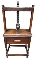 A 19TH CENTURY FRUITWOOD BOOK PRESS ON LATER ASSOCIATED TABLE BASE With single drawer, raised on