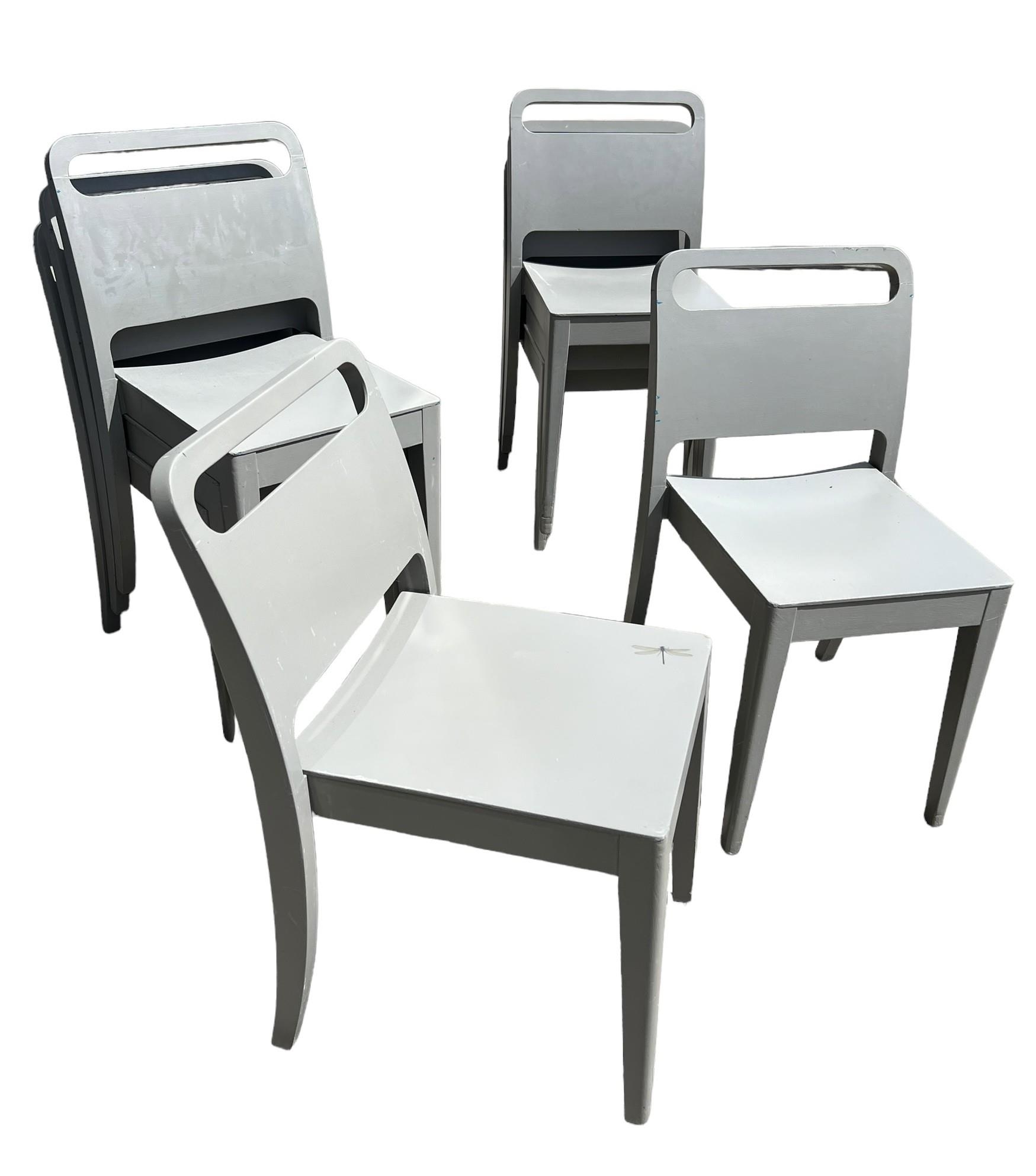 A SET OF EIGHT PAINTED DESIGNER STACKING CHAIRS. - Image 2 of 3