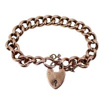 AN EDWARDIAN 9CT ROSE GOLD CURB LINK CHARM BRACELET Having heart shaped padlock clasp. (approx
