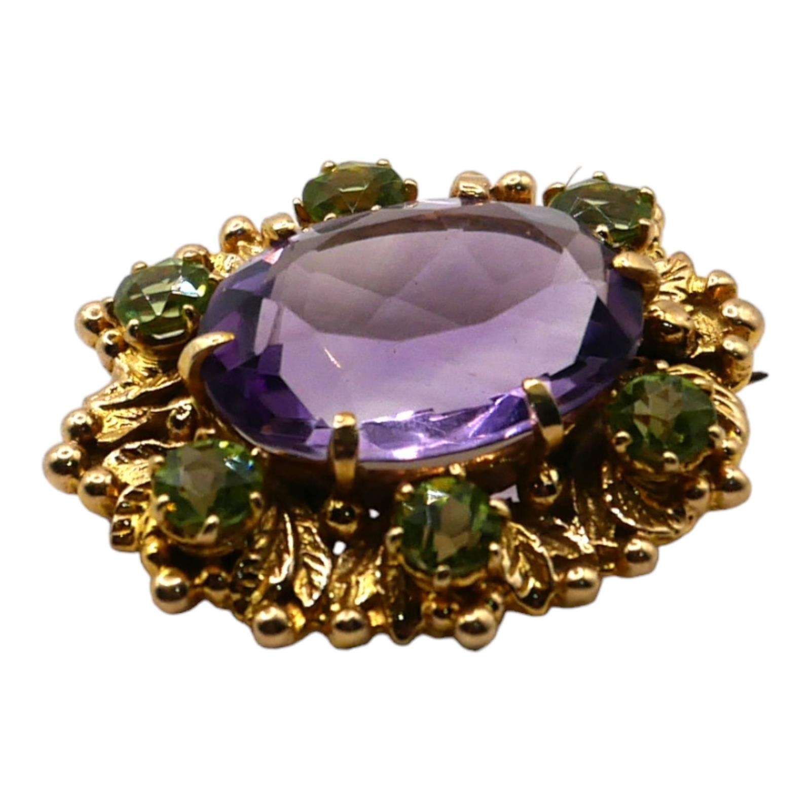 A VINTAGE 9CT GOLD, AMETHYST AND PERIDOT BROOCH Having large central oval cut amethyst (approx. 16mm - Image 3 of 3
