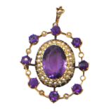 A LARGE VICTORIAN 9CT GOLD, AMETHYST AND SEED PEARL PENDANT Having central oval cut amethyst (