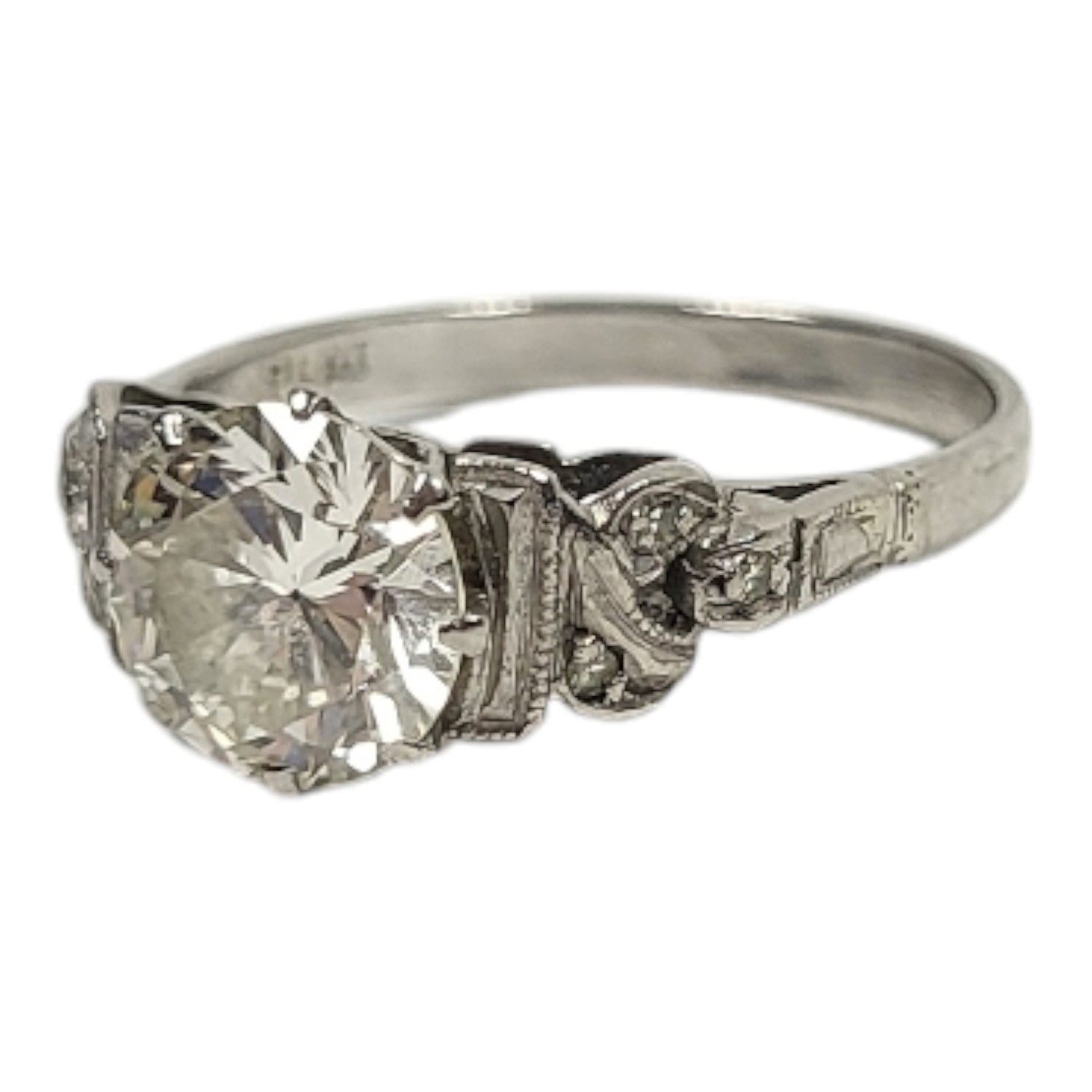 AN EARLY 20TH CENTURY PLATINUM AND 1.2CT DIAMOND SOLITAIRE RING The single round cut diamond in a - Image 2 of 2