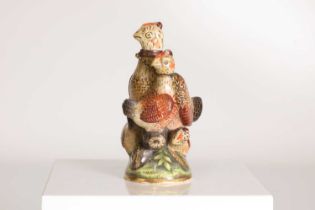 An English porcelain figural scent bottle,