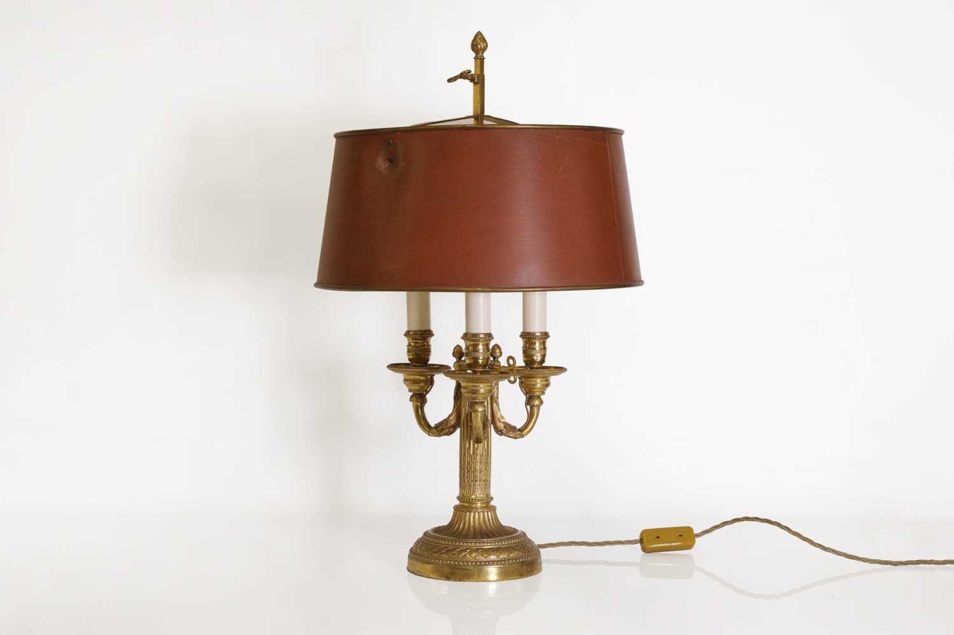 A Directoire-style ormolu three-light bouillotte lamp,