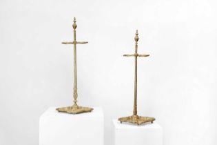 A pair of brass umbrella stands,