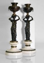 A pair of Louis XVI patinated bronze and white marble candlesticks,