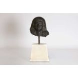 An Egyptian-style carved granite head of a man,