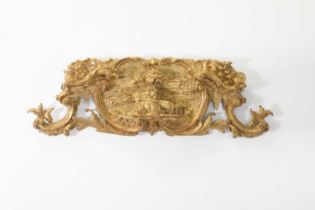 A George III carved giltwood panel in the manner of Thomas Johnson,