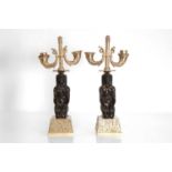 A pair of Empire-style gilt and patinated bronze candelabra,