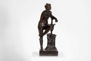 A patinated bronze figure after the antique,