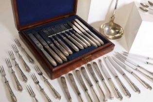 A collection of silver flatware,