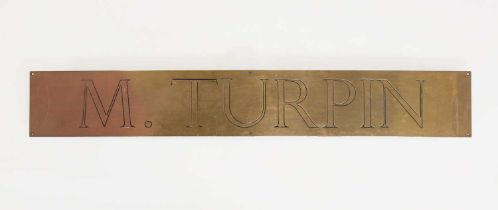 A brass plaque inscribed 'M. Turpin',