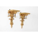 A pair of George III-style giltwood wall brackets,