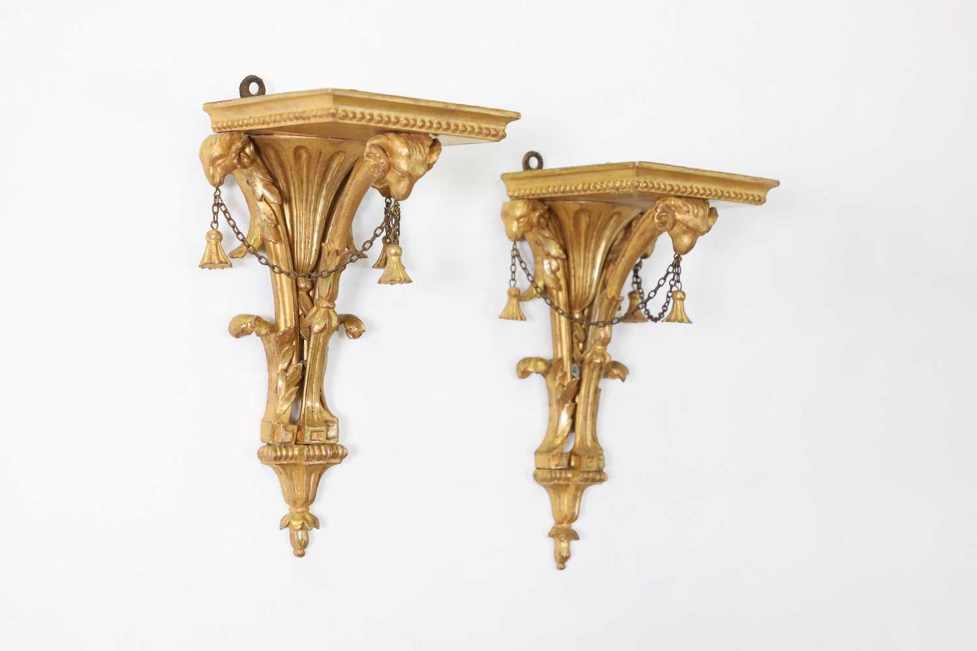 A pair of George III-style giltwood wall brackets,