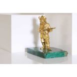 A gilt-bronze figure of a musician,