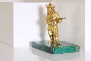 A gilt-bronze figure of a musician,