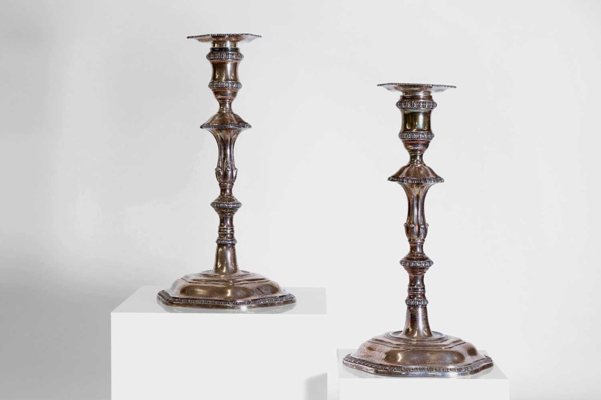 A pair of George III silver candlesticks,