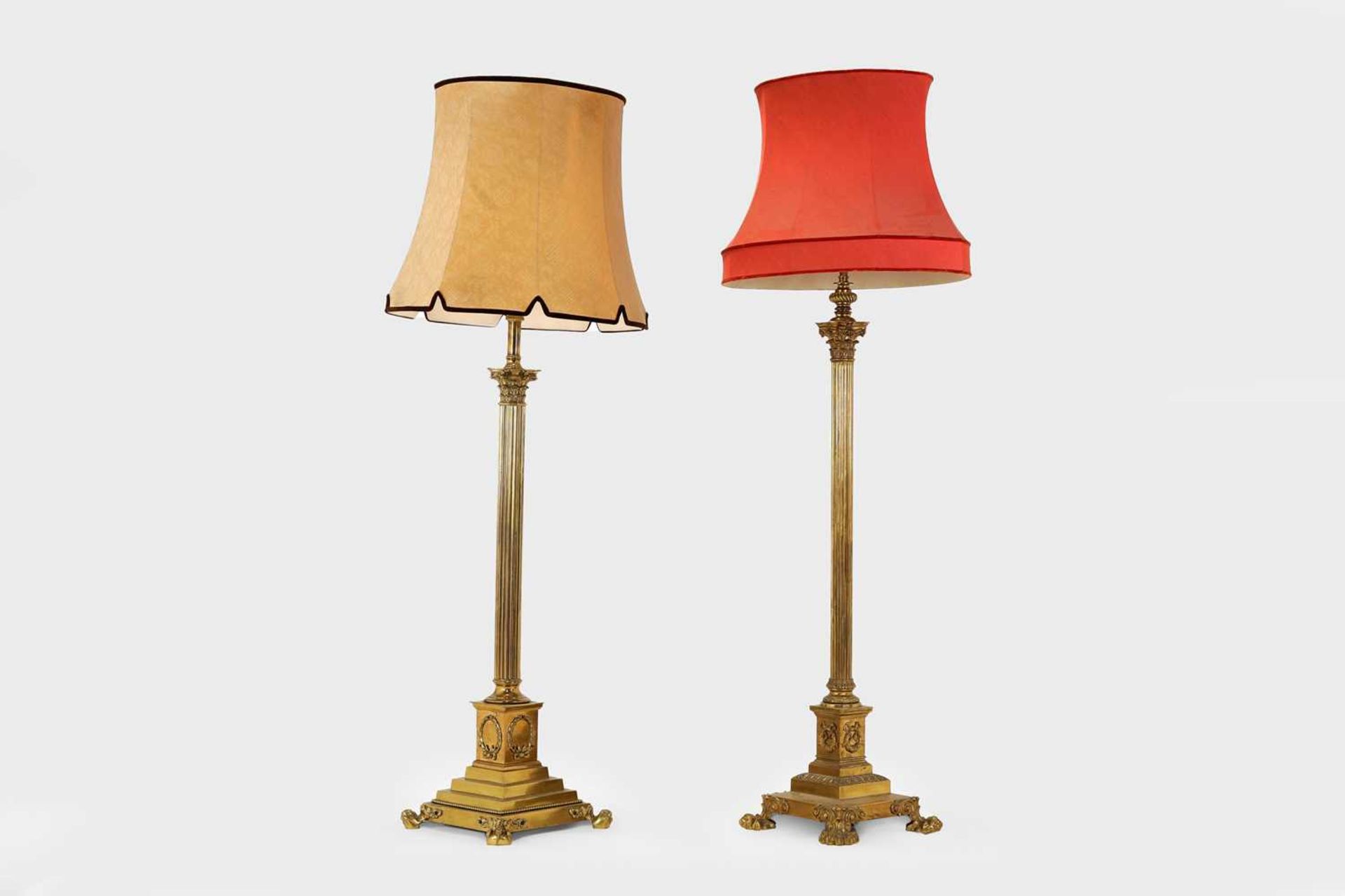 A near pair of telescopic brass column floor lamps,