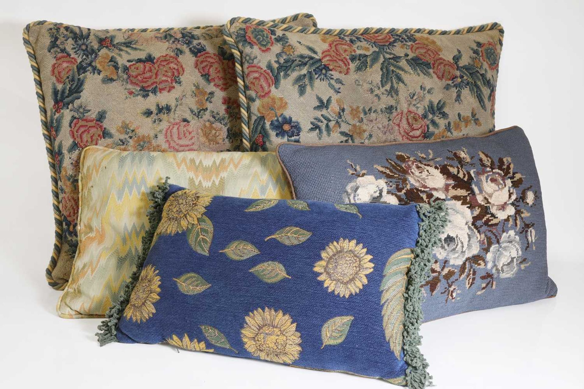 A group of five cushions,