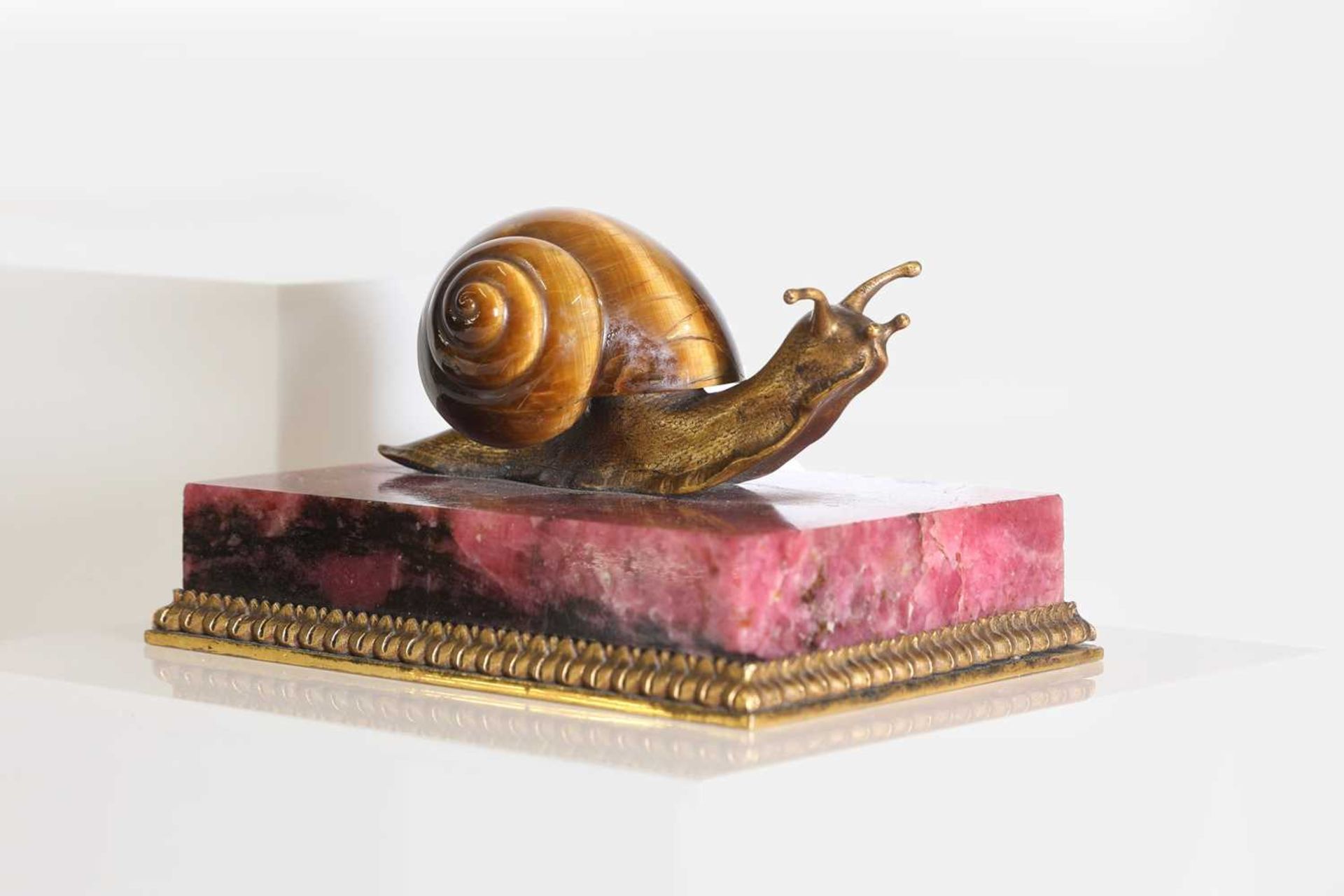 A tiger's eye and ormolu snail,