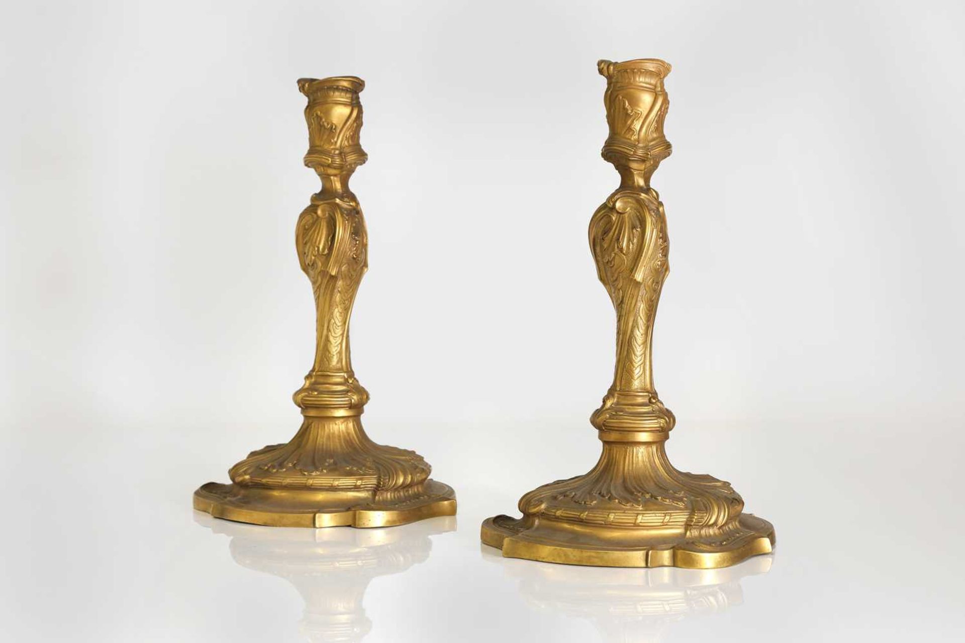 A pair of Louis XV-style ormolu candlesticks,