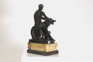 A patinated bronze figure after the antique,