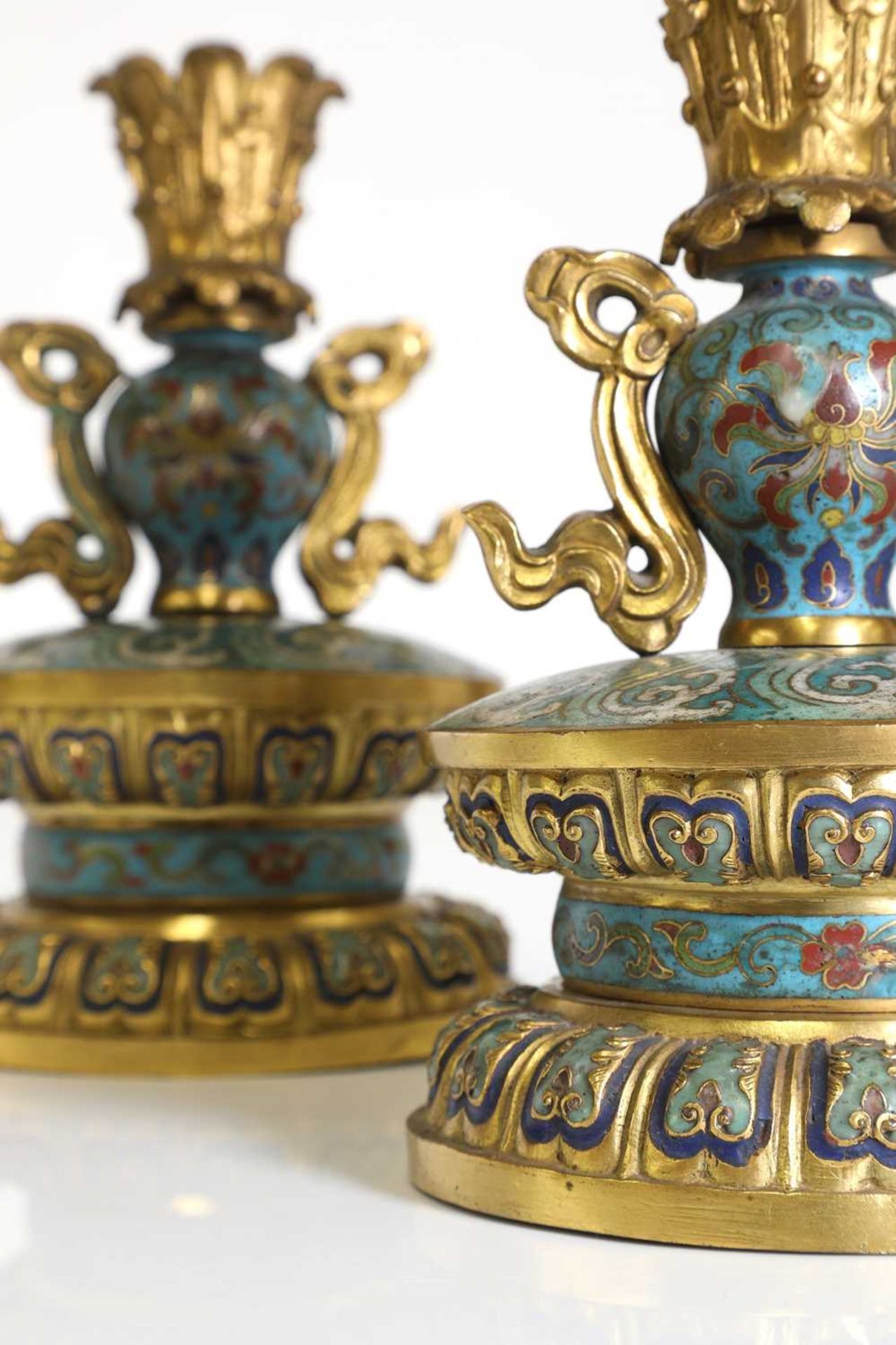 A pair of gilt-metal-mounted cloisonné candlesticks,