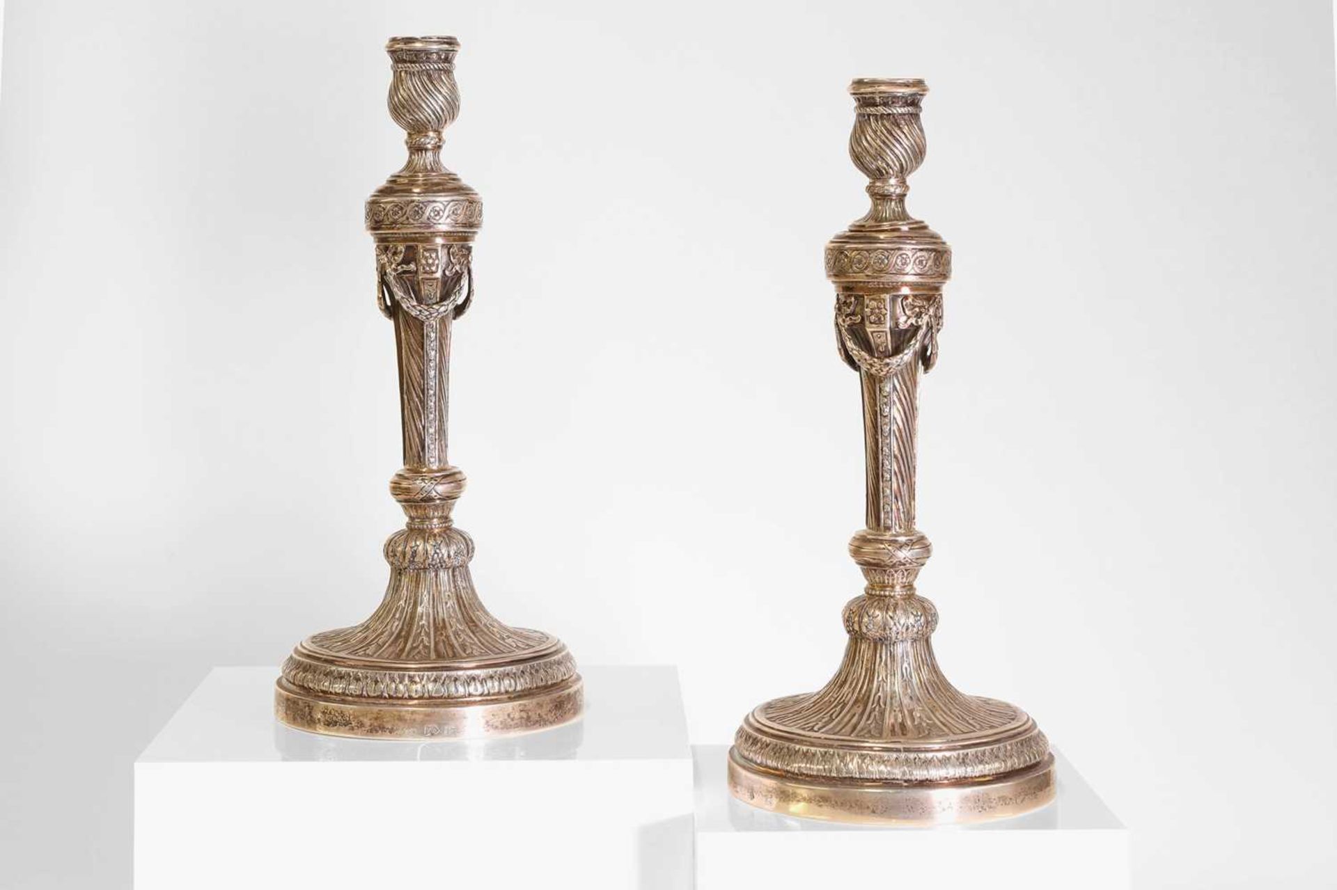 A pair of German cast silver candlesticks,