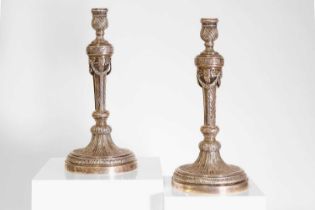 A pair of German cast silver candlesticks,