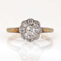 An early 20th century diamond daisy cluster ring,