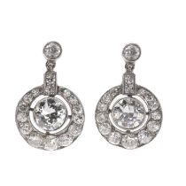 A pair of graduated diamond set pendant earrings,