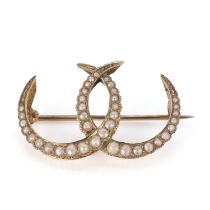 An Edwardian gold split pearl double crescent brooch, by Murrle Bennett & Co.,