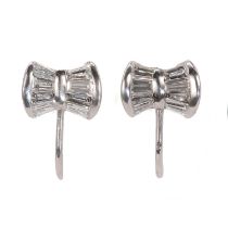 A pair of white gold and baguette cut diamond screwback earrings,