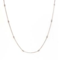 An 18ct white gold diamond station necklace,