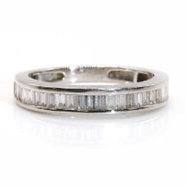 A platinum baguette cut diamond half eternity ring, by Rhapsody,