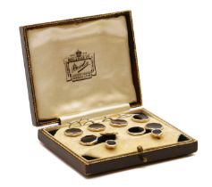 A boxed set of gold and platinum cufflinks and dress studs,