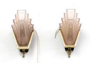 A pair of Art Deco pink-tinted wall lights,