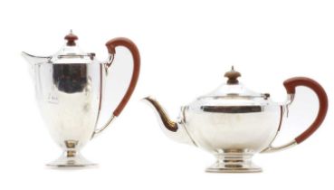 A silver hot water and teapot