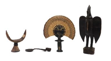 A group of carved African items