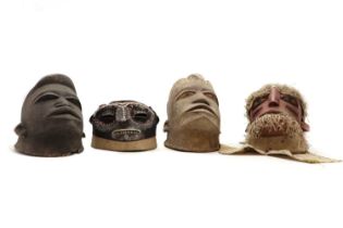 A group of four Makonde helmet masks,