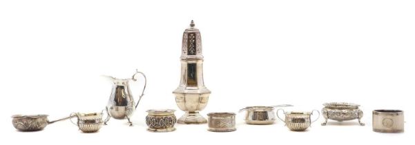 A group of silver cruet items
