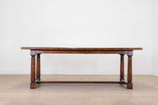 A pollard oak refectory table by Theodore Alexander,