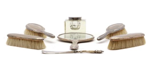 A group of silver dressing table items