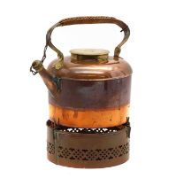 A vintage copper and brass picnic kettle