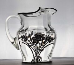 A silver overlaid glass water jug,